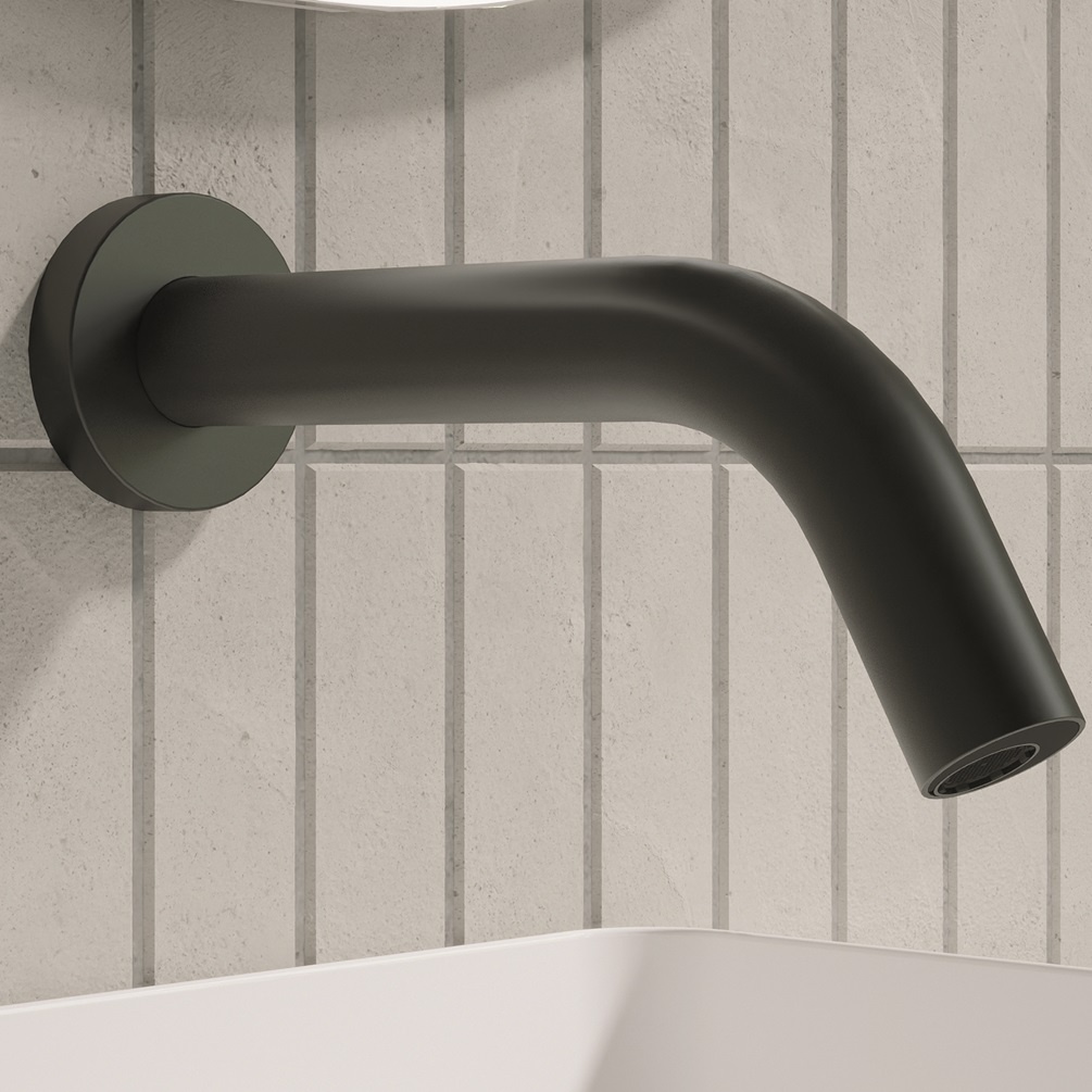 product lifestyle image close up of Crosswater MPRO Sensor Matt Black 208mm Wall mounted Basin Spout with white vertical rectangle thin tiles PROX0160WM_220